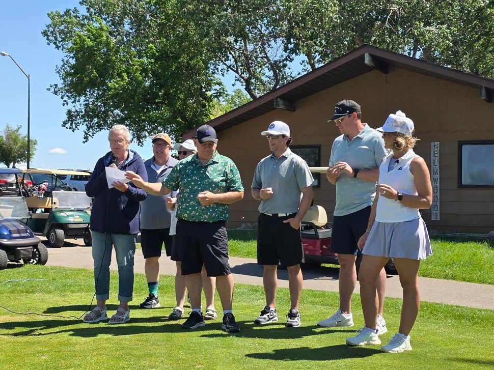 Organizers stand together for the opening remarks at the tournament. 